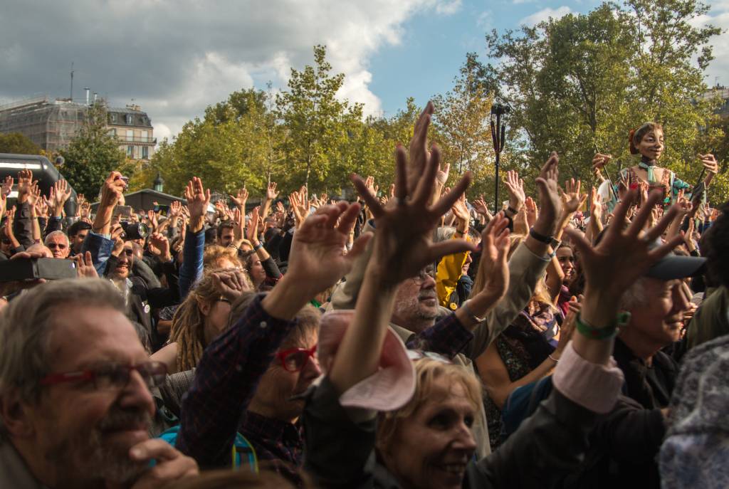 Thousands gathered in Paris to call on world leaders to move away from fossil fuels