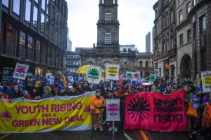 Green New Deal Rising marching in Glasgow at COP26