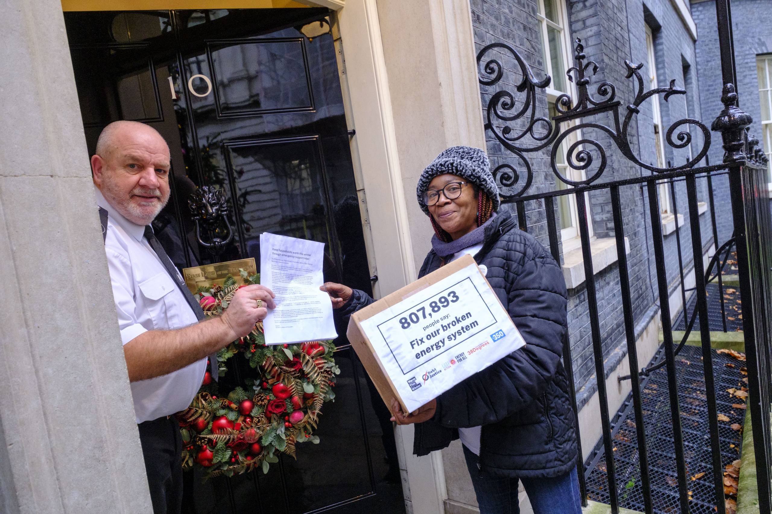 Woman handing in petition to 10 Downing Street