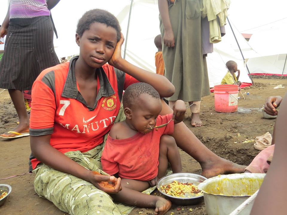 A displaced mother and  child in an emergency settlement. Photo credit: Red Cross Burundi 