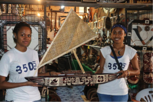 350 Fiji Volunteers with a model of a traditional canoe