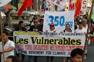 Around 300 members from the Philippine Movement for Climate Justice (PMCJ) and its members marched towards Malacanang today to demand to French President Hollande to fulfill the climate obligation of France and other developed countries.  Photo: AC Dimatatac
