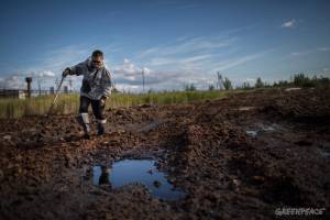 Sergey Kechimov shows the traces the oil companies left on Khanty land - courtesy Denis Sinyakov, Greenpeace 