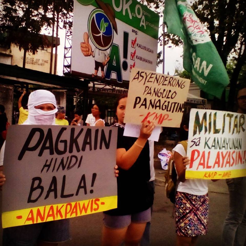 Bagong Alyansang Makabayan (BAYAN) together with the peasant party-list group Anakpawis and other sectoral organizations staged an indignation protest in front of the National Office of the Department of Agriculture in Quezon City to condemn the violent dispersal holding the Aquino administration accountable for this heinous crime. (c) Leon Dulce