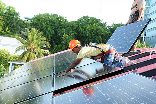 During the installation of solar panels on the presidential residence in the Maldives, in 2010. Photo: Mohammed Ali