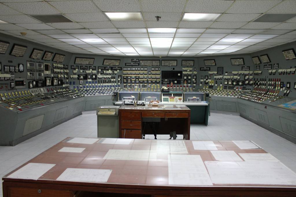 Analog knobs and switches from the mainframe computer occupyy the control room of the mothballed Bataan Nuclear Power Plant, in the Philippines. Photo: Albert Lozada