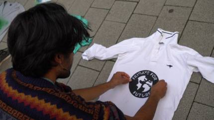 youth climate organiser shayli from germany makes fridays for future t-shirts ahead of the global climate strike