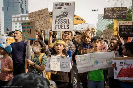 Activists march for an end to fossil fuels.
