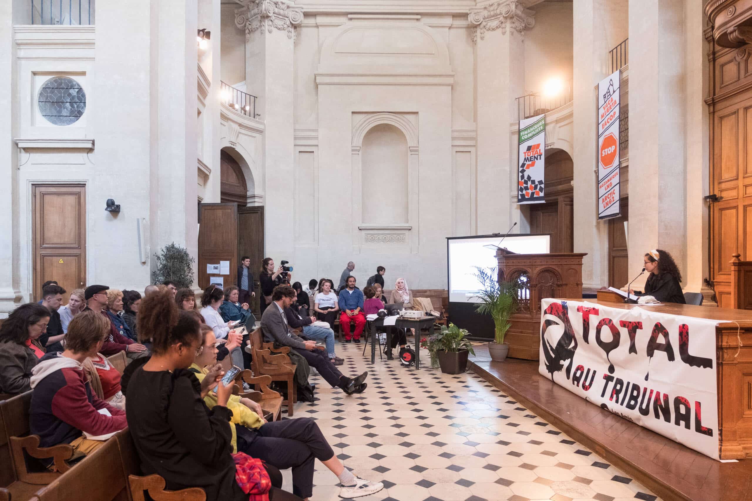 Prior to Total's Annual General Meeting, 350.org and partners organize a mock trial to symbolically indict Total and its financiers, Ile-de-France, France. Photo: Sidney Léa Le Bour