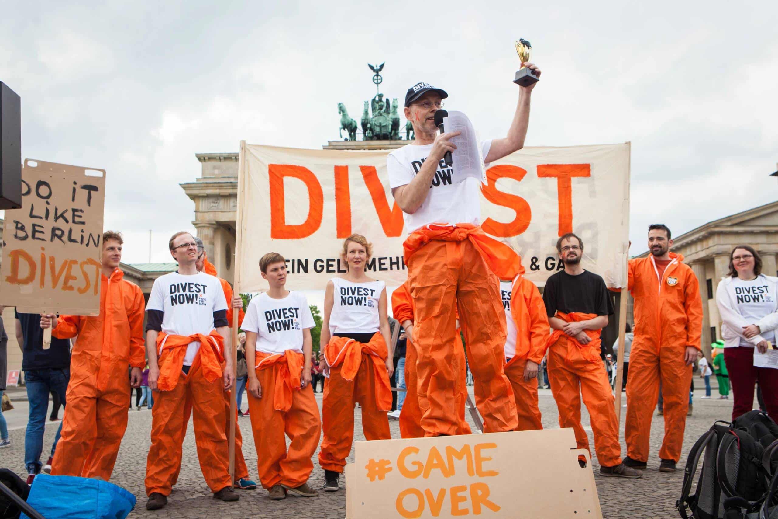 Fossil Free Berlin organizes action in front of Brandenburg Gate. Berlin, Germany.