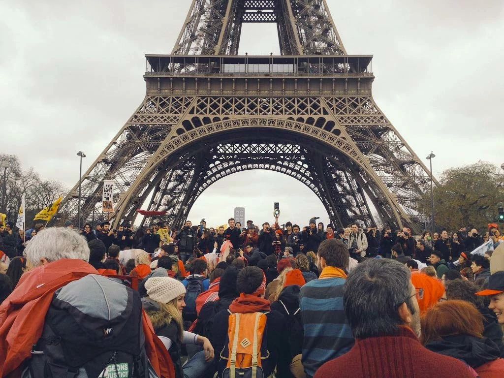 More than 10,000 people protest to ask world leaders to commit to urgent climate action, Paris, France. Photo: Collin Rees