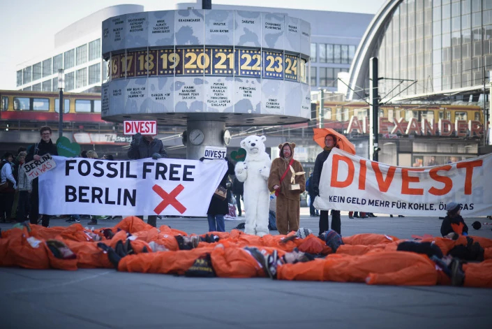 Global Divestment Day action at Alexanderplatz, in Berlin, Germany. Photo: Ruben Neugebauer