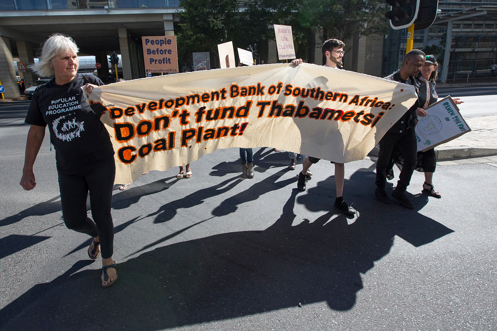 A group of individuals and activists gather in Cape Town calling on the Development Bank of Southern Africa (DBSA) to not fund the Thabametsi coal fired power station.