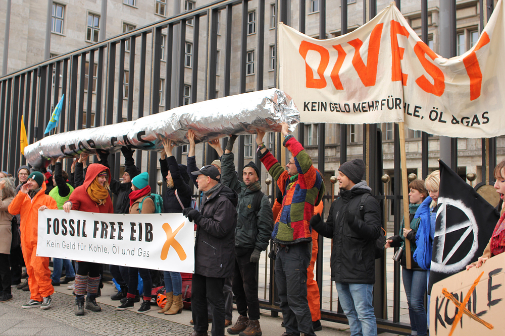 Activists gather for a rally outside the German Finance Ministry, ahead of EIB’s decision to ban fossil fuel funding, Berlin, Germany.