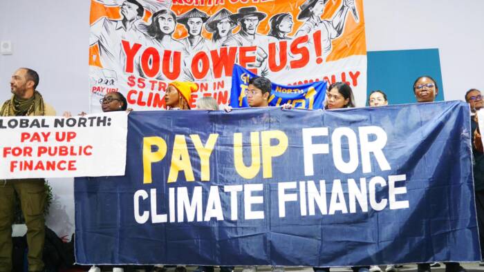 People power in action at the UN Climate Change Conference, advocating for climate finance solutions to drive a just and sustainable future.